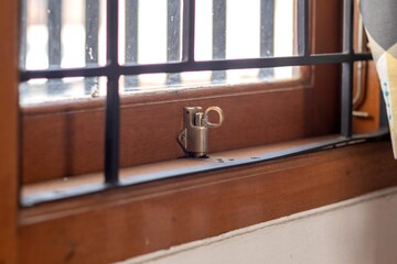 A house window with a trellis, closed and locked