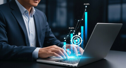 Businessman analyzing financial growth data on a laptop with futuristic interface