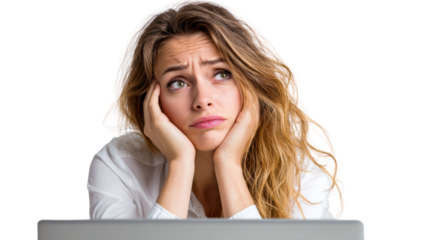 Pensive young woman with long hair, resting her chin on her hands, looking contemplative while seated at a desk.