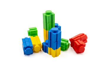 Colorful stacked plastic building blocks on white background