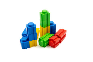 Colorful stacked plastic building blocks on white background