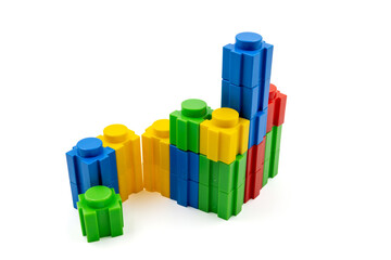 Colorful stacked plastic building blocks on white background