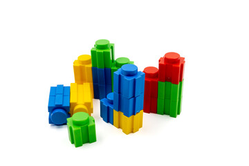 Colorful stacked plastic building blocks on white background