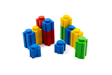 Colorful stacked plastic building blocks on white background