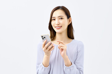 Fototapeta premium スマホを持つ若い女性 主婦 ビジネスウーマン