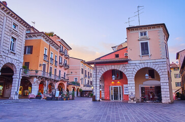 The purple dusk over Piazza Giuseppe Malvezzi square, Desenzano del Garda, Italy