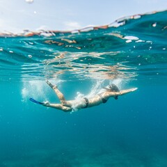 Dynamic Low Angle View of Person Diving into Crystal Clear Water with Sunlight