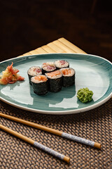 Fresh hosomaki rolls, filled with salmon and tuna,