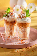 Sweet ice coffee served with glass and straw.