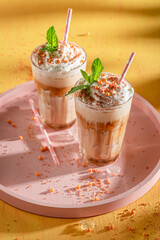 Delicious ice coffee served with glass and straw.