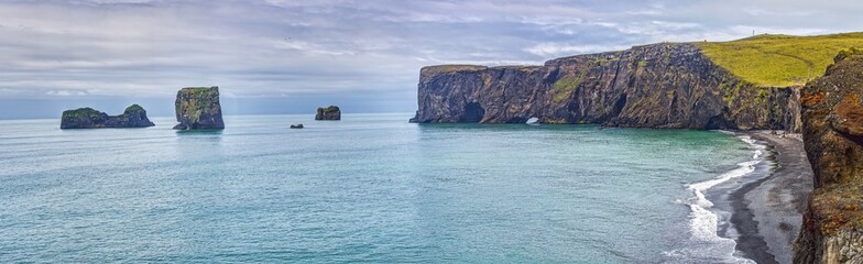 Fototapeta premium Sea stacks and cliffs Reynisfjara beach Iceland