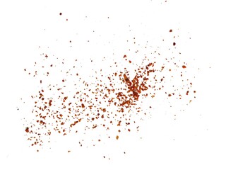 Sprinkle of chopped hot red chili peppers or paprika, paprika or red chili powder isolated on white background. Crushed red chili or chopped paprika. A pile of ground red chili or paprika.