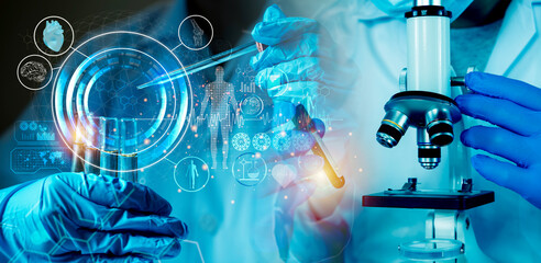 Scientist researching medical innovation with microscope and digital health technology in...