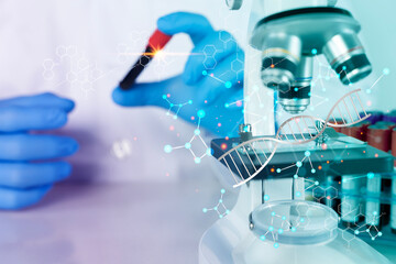 Scientist analyzing DNA with microscope and test tube in futuristic laboratory, biotechnology...