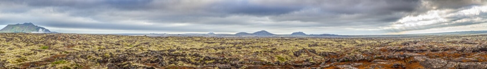Panoramic moss lava field landscape near Grindavik Iceland under cloudy sky