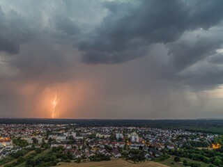 Thunderstorm with lightning over Moerfelden Walldorf Germany cityscape