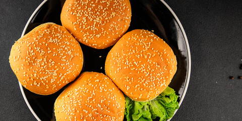 Bun burger puffy soft buns baking fresh delicious gourmet food background on the table rustic food...