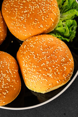 Bun burger puffy soft buns baking fresh delicious gourmet food background on the table rustic food...