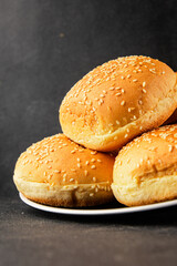 Bun burger puffy soft buns baking fresh delicious gourmet food background on the table rustic food top view copy space