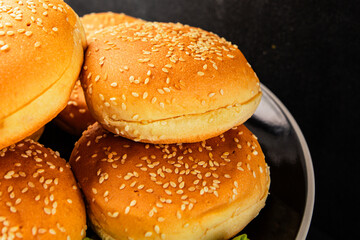 Bun burger puffy soft buns baking fresh delicious gourmet food background on the table rustic food...