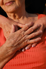 An adult woman hugs her old mother. Concept of support and care, love, warmth, Mother's day, help.