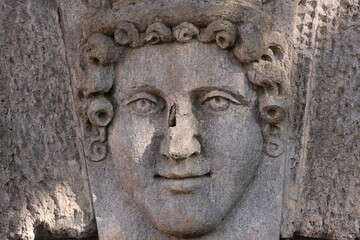 A mural of a man's face on the side of a building, urban landscape, street art