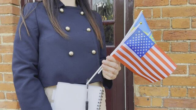 Woman with USA and Ukraine flags, symbol of immigration, study, and hope.