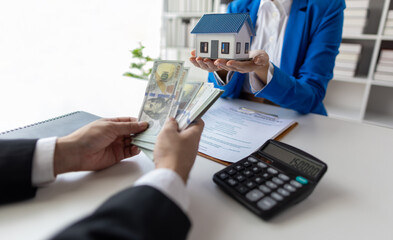 Businesswoman, real estate agents discuss offer house sale prices, fee, mortgage, interest, rent,...