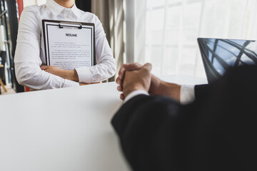 Job interview, unemployed woman submits job application and interviews. Manager read resumes and...