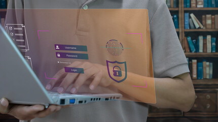 Man typing on keyboard with login name and password on screen display. Concept of cyber security,...