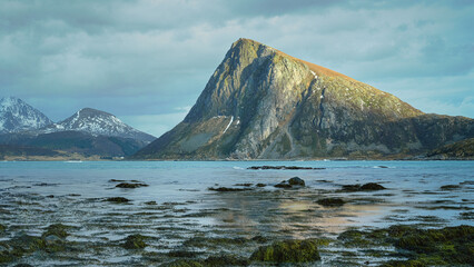 Lofoten Mountain Peak Rises Above Calm Coastal Waters