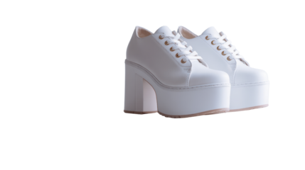 Stylish white platform sneakers with laces on a white isolated background.