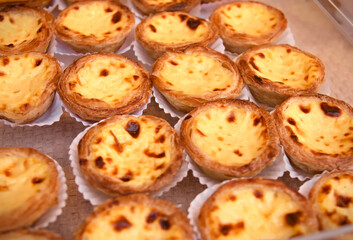 Traditional portuguese cakes pasteis de nata. Freshly baked crunchy traditional Portuguese dessert.
