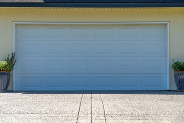Garage door in luxury house with trees and nice landscape in Spring in Vancouver, Canada, North...
