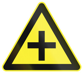 Warning road sign in China - Crossroads