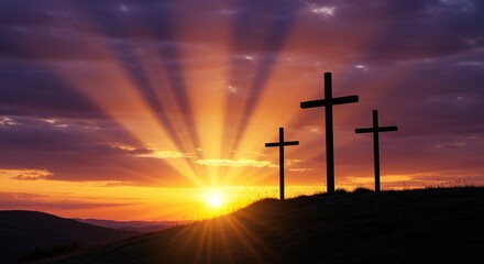 Three crosses stand silhouetted against a vibrant sunset sky, symbolizing faith, hope, and renewal with natural beauty.