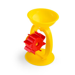 Yellow plastic toy windmill on a white background.