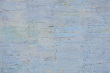 Obraz premium Faded blue textured wall with peeling paint image