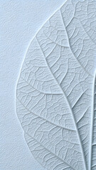 Pale blue embossed leaf detail showcasing intricate vein patterns on textured background.