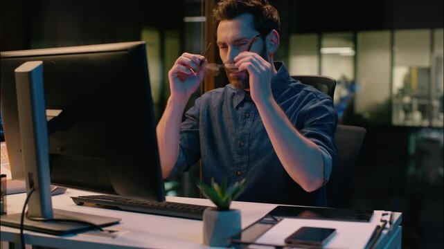 Caucasian businessman tired guy business man exhausted overwork male employer in glasses working computer suffer eyesight ache dry eyes at night evening office overwork headache pain health tension