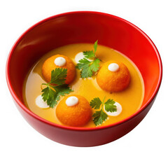Gourmet creamy carrot soup with orange dumplings and fresh parsley isolated on transparent background