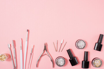 Manicure tools arranged on a soft pink background, perfect for nail salons, manicure courses, and...