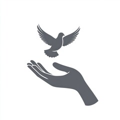 Fototapeta premium A hand gently cradling a soaring dove