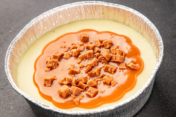 Cheesecake salted caramel sweet dessert fresh delicious gourmet food background on the table rustic food top view copy space