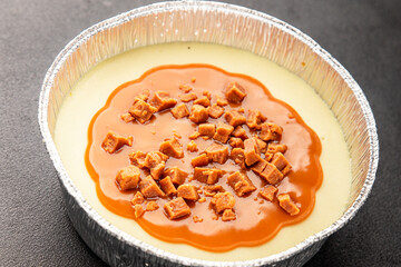 Cheesecake salted caramel sweet dessert fresh delicious gourmet food background on the table rustic food top view copy space