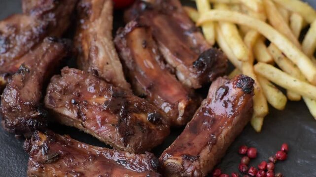Meat, beef ribs in a marinade grilled with salt and spices. Grilled ribs, barbecued meat food
