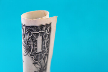 Rolled up one dollar bill