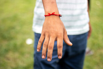 A boy show his hand and blur background