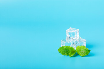 Mint and ice on texture background. Green fresh mint and ice cube. Mint leaves, ice cube and water...