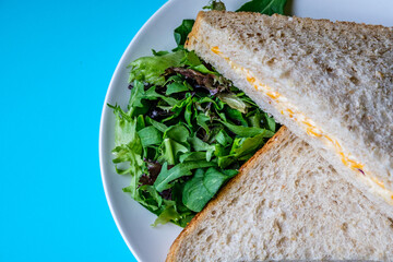 Freshly Made Tasty Cheese And Onion Sandwich With Green Salad Leaves